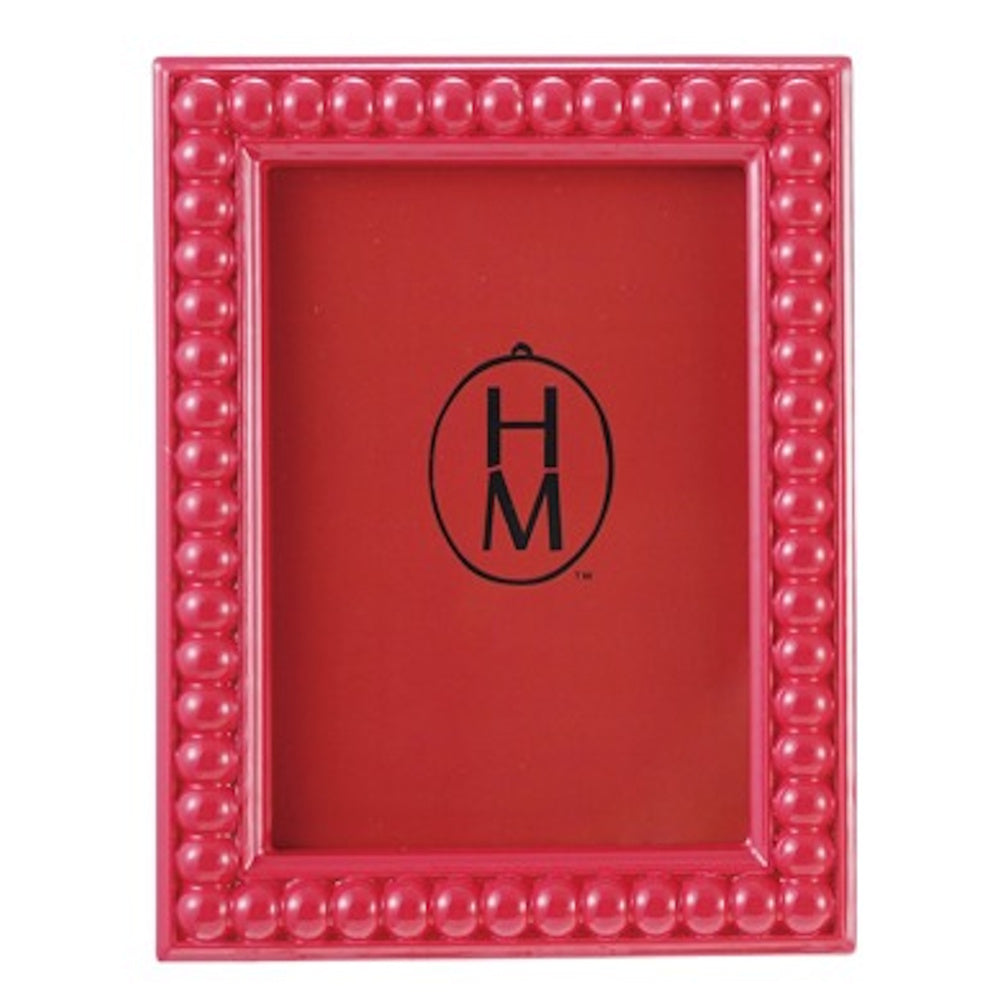 A glossy red bobbin-style picture frame with a beaded border and a red insert featuring a black "HM" logo.