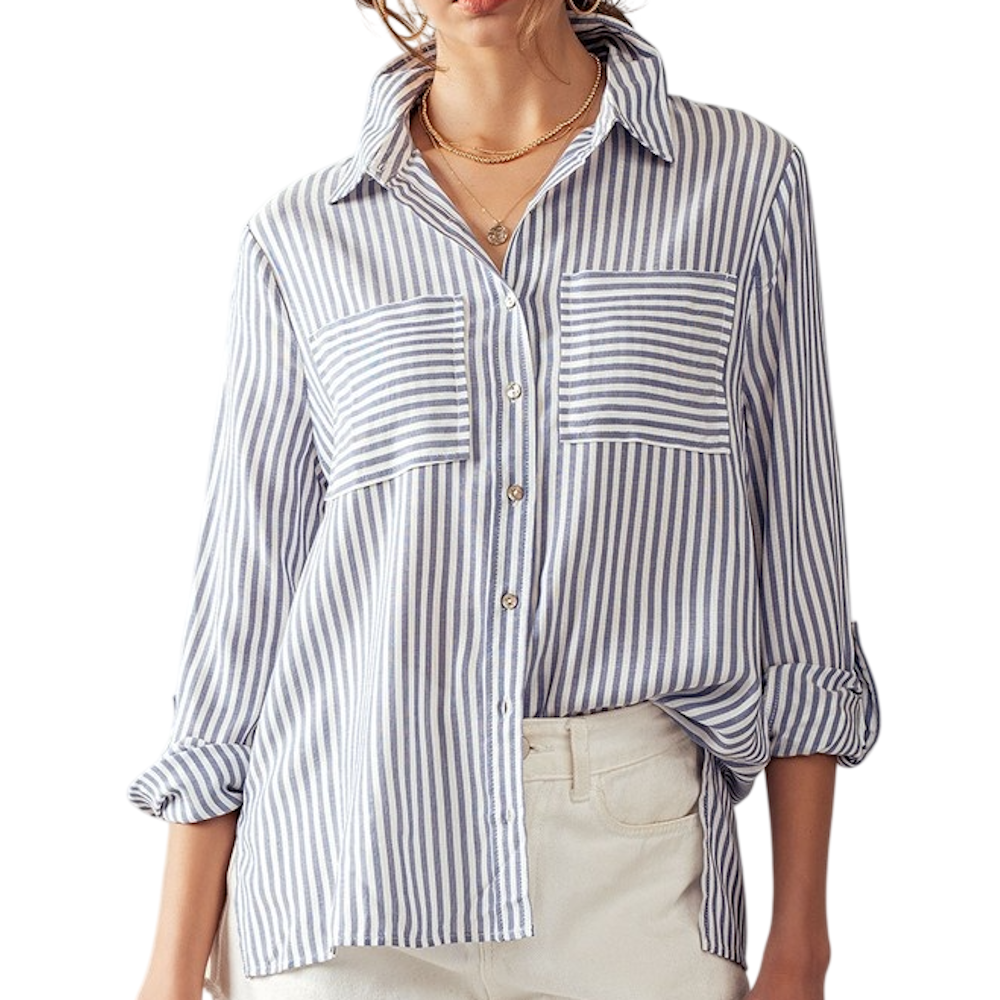 Woman wearing a blue and white vertical striped button-down shirt with chest pockets.