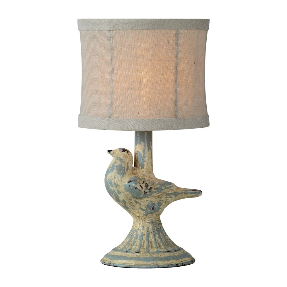 Vintage rustic bird table lamp with distressed paint finish and linen drum shade for farmhouse home decor.