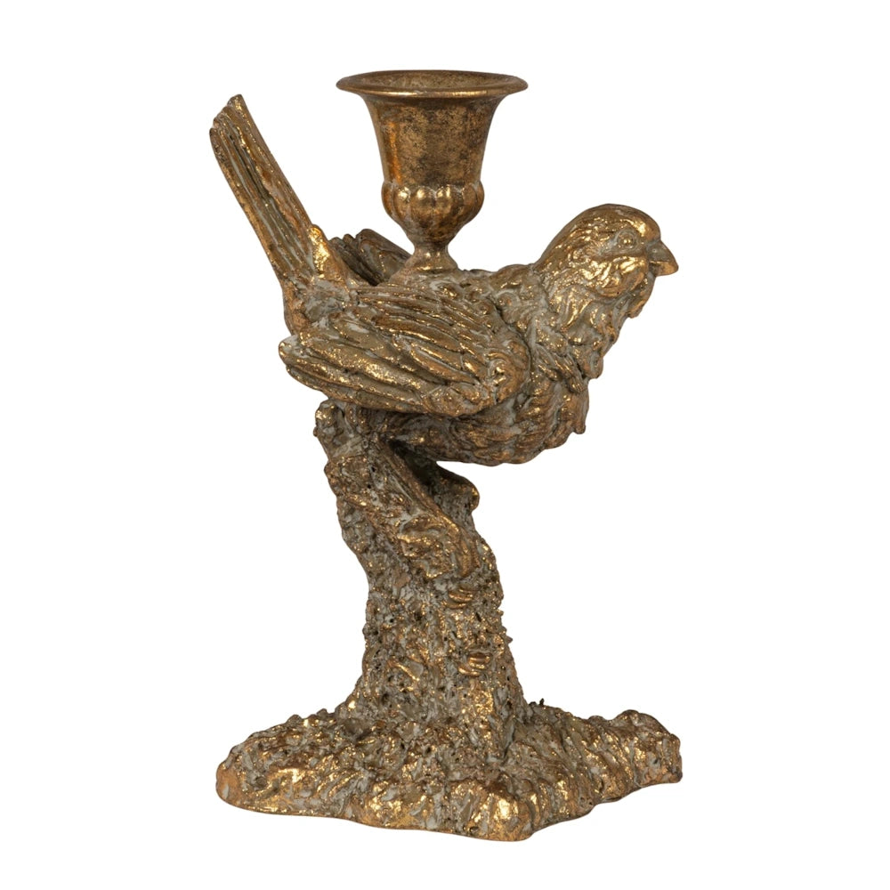 Gold bird-shaped taper candle holder on a textured branch base with a vintage metallic finish on a white background.