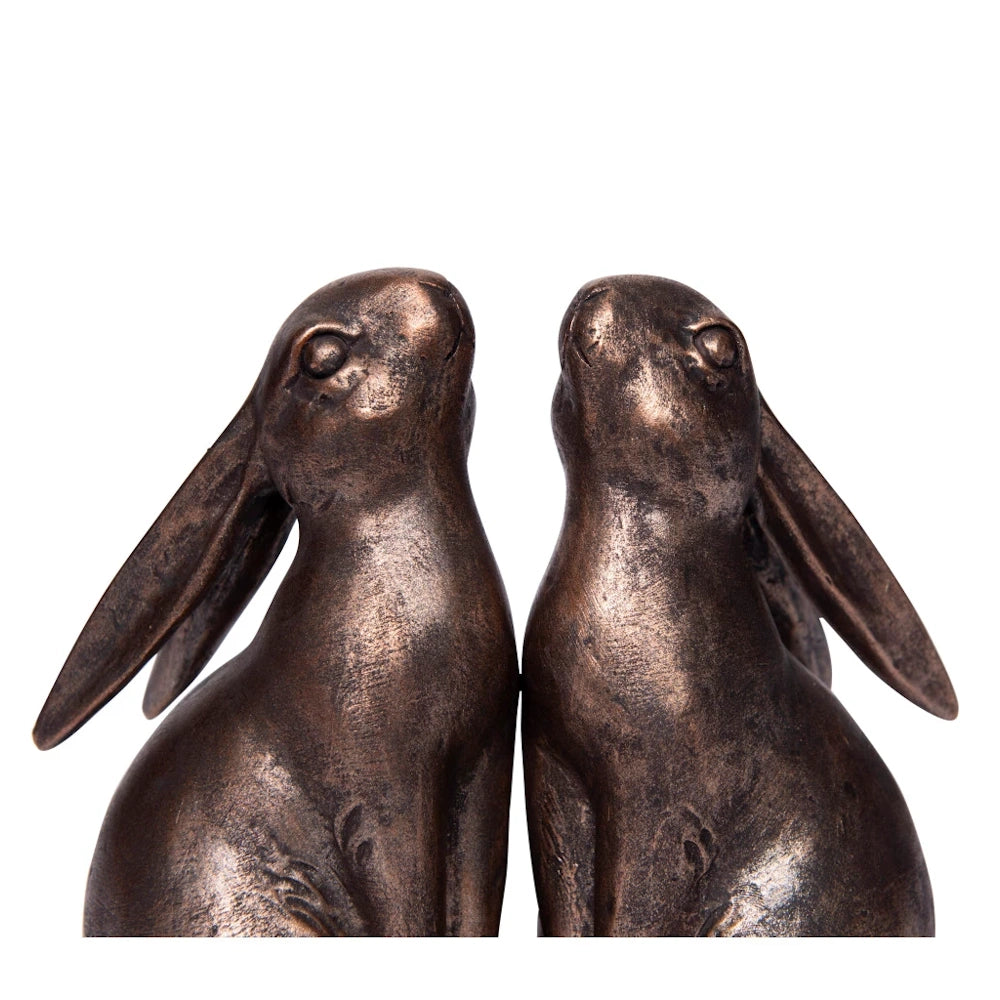 Bronze-effect resin bunny bookends facing each other, decorative rabbit home decor for shelves.