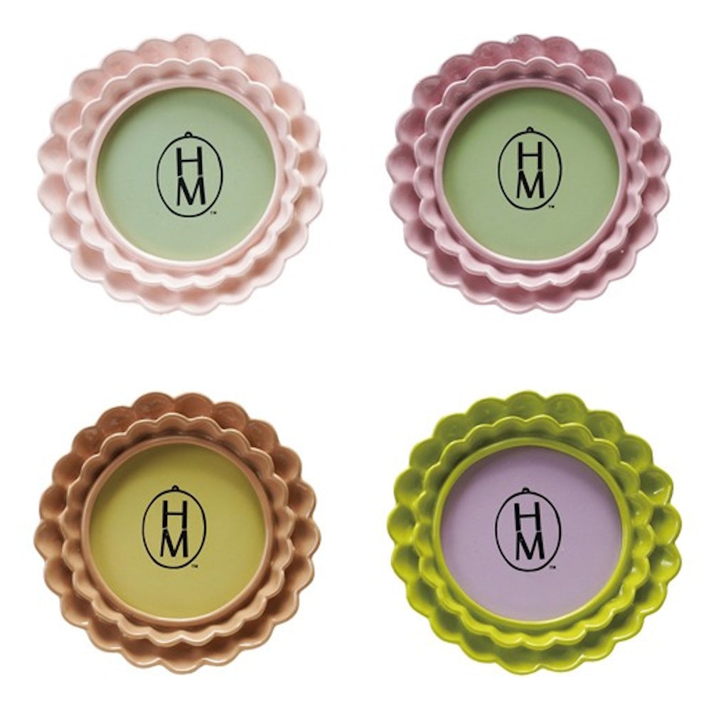 Four round photo frames with ruffled edges in light pink, mauve, tan, and lime green, arranged in a two-by-two grid.