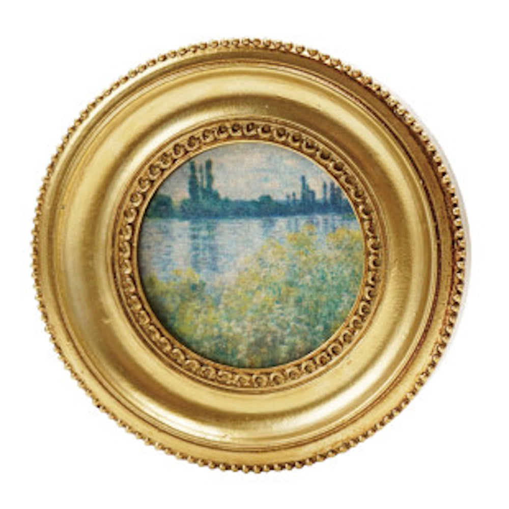 Miniature resin magnet featuring a classic impressionist landscape painting in a round ornate gold frame.