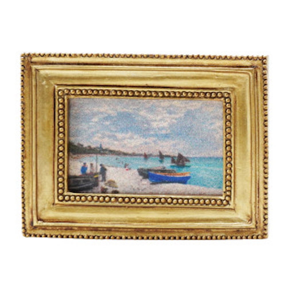 Impressionist beach painting with blue boats in a beaded gold frame.