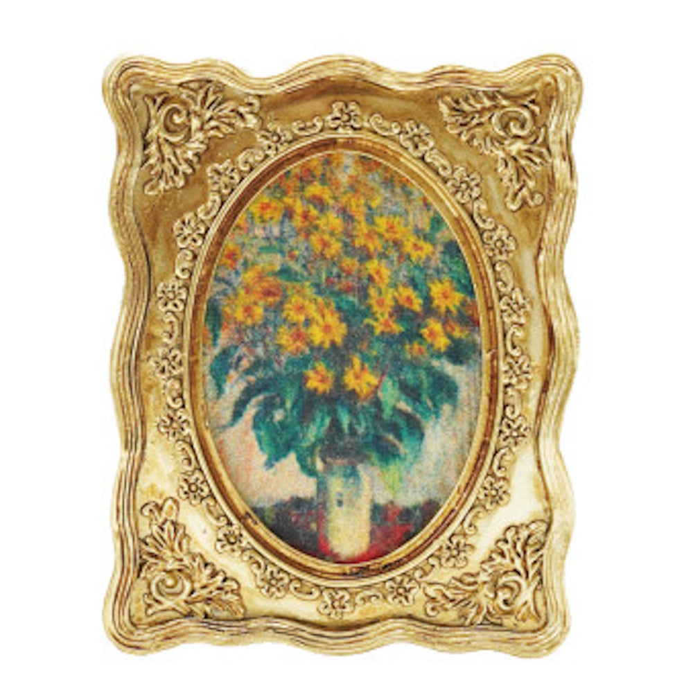 A miniature ornate gold framed painting of yellow flowers.