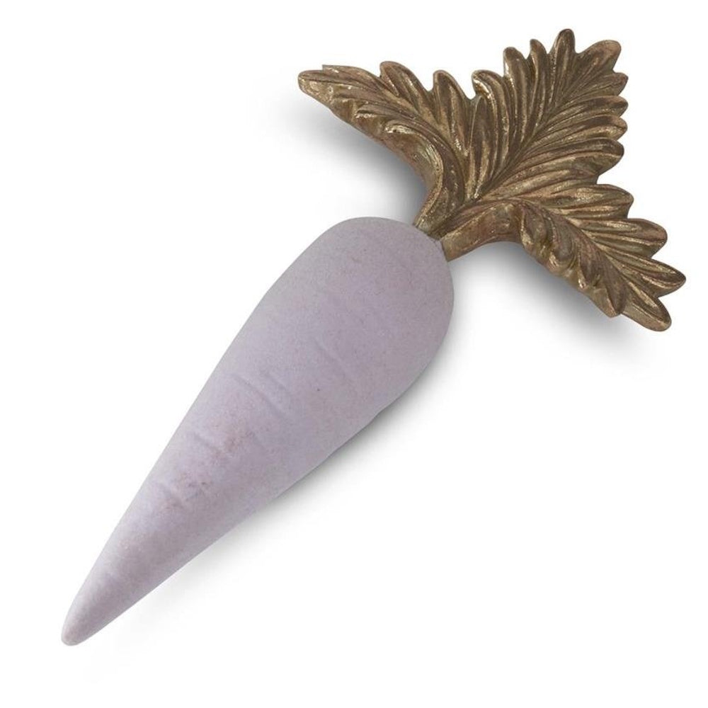 Decorative light purple carrot figurine with ornate gold leaves on a white background.