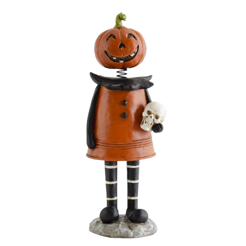 Vintage-style pumpkin girl bobblehead figurine wearing an orange dress and holding a skull.