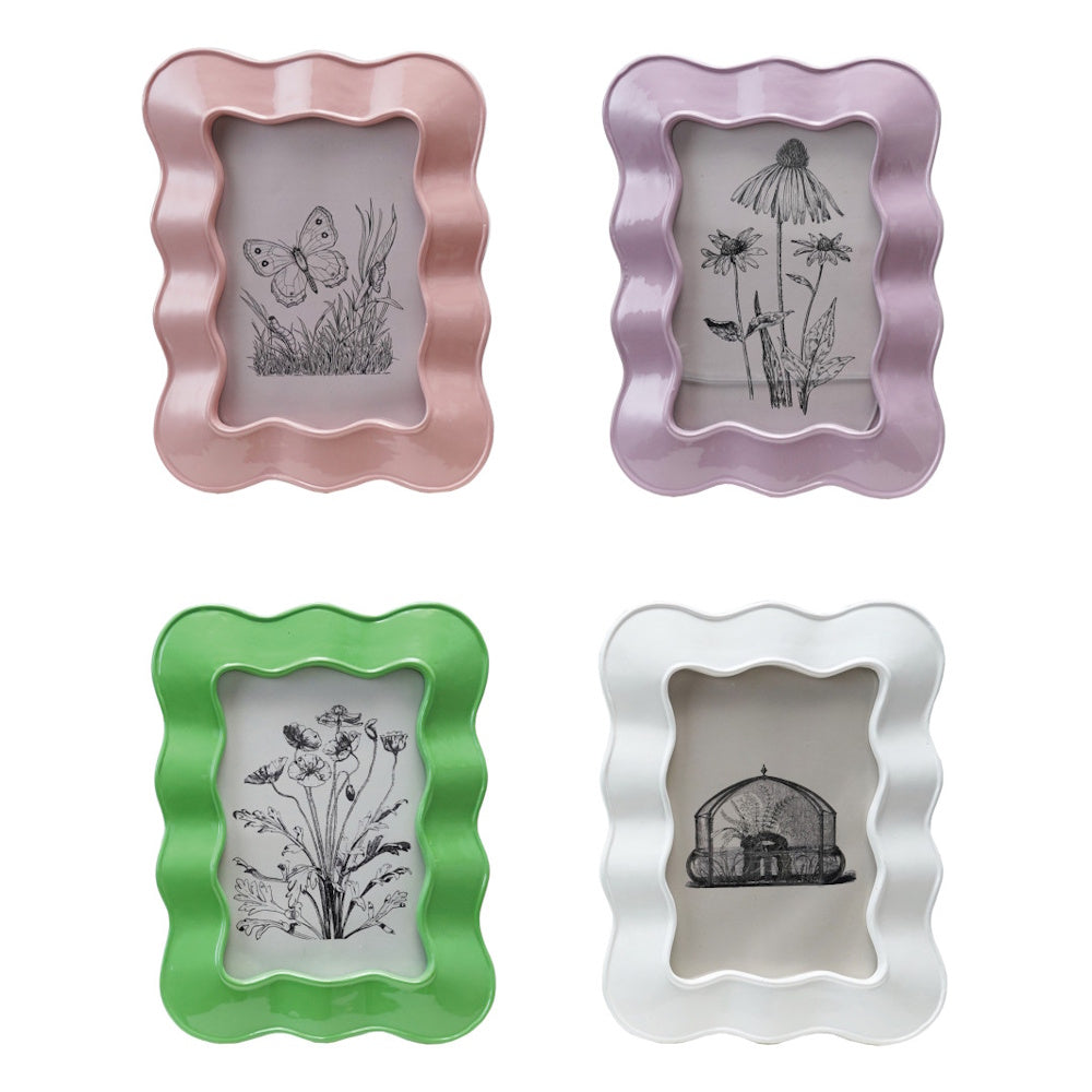 Set of four wavy resin picture frames in pink, purple, green, and white with vintage botanical art.