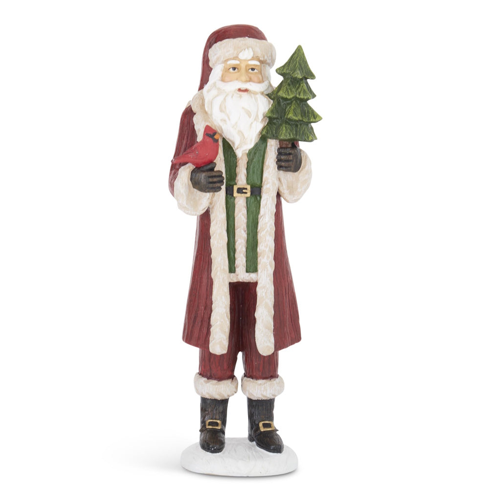 Resin Santa figurine in a red coat holding a cardinal and small evergreen tree.