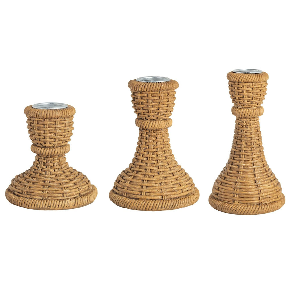 Set of three graduated resin woven taper candle holders with a natural rattan-style texture and metal inserts.