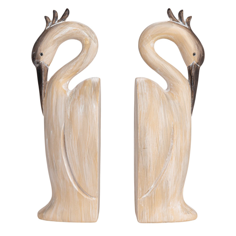 Pair of beige resin heron-shaped bookends with a distressed faux wood finish.