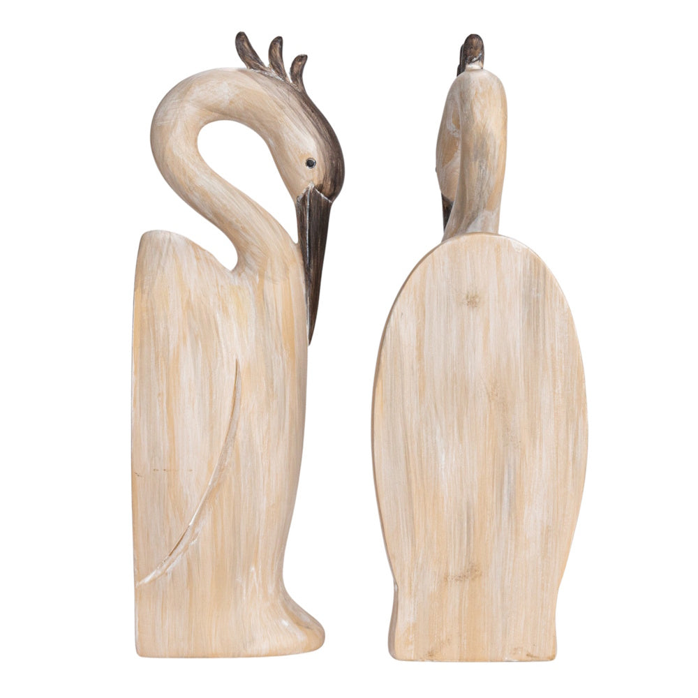 Pair of resin heron-shaped bookends with a faux-carved wood grain finish.