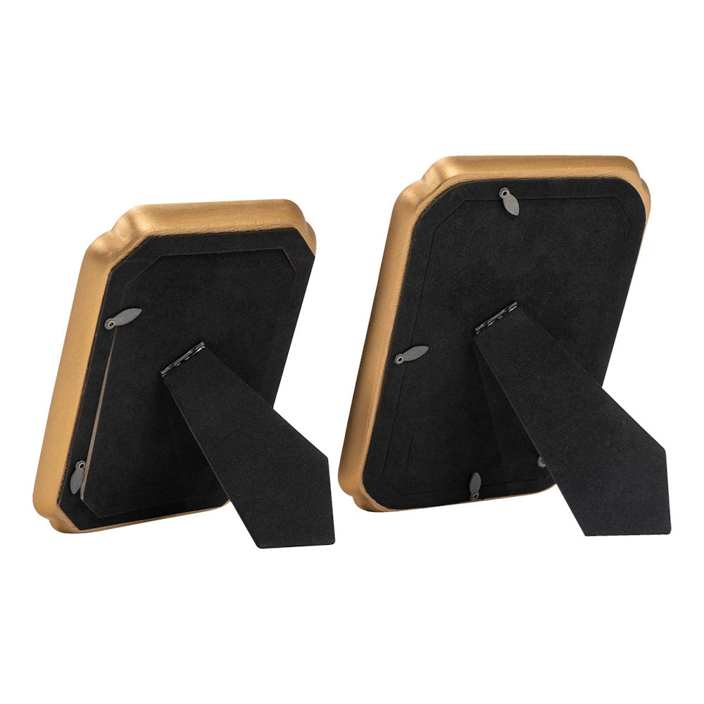Back view of two gold picture frames with black velvet easel backs and swivel tabs on a white background.