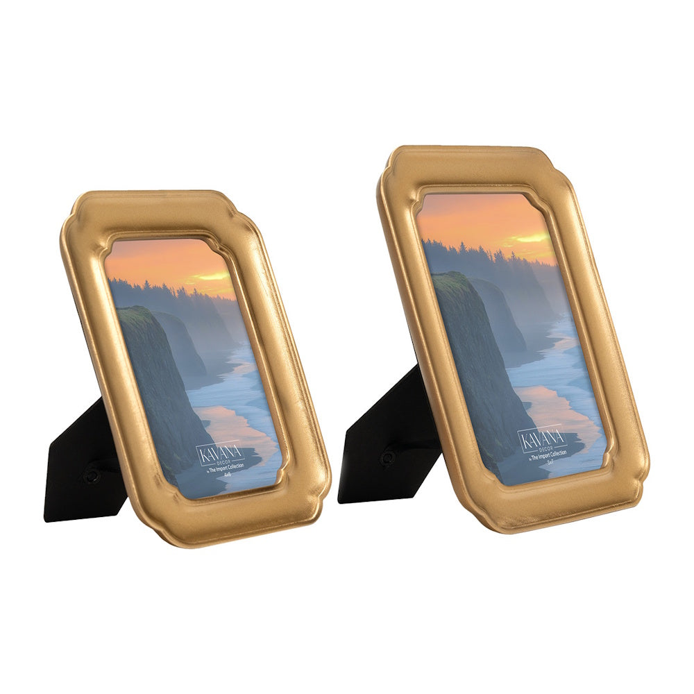 Two gold vintage-style picture frames in different sizes featuring a coastal sunset landscape.