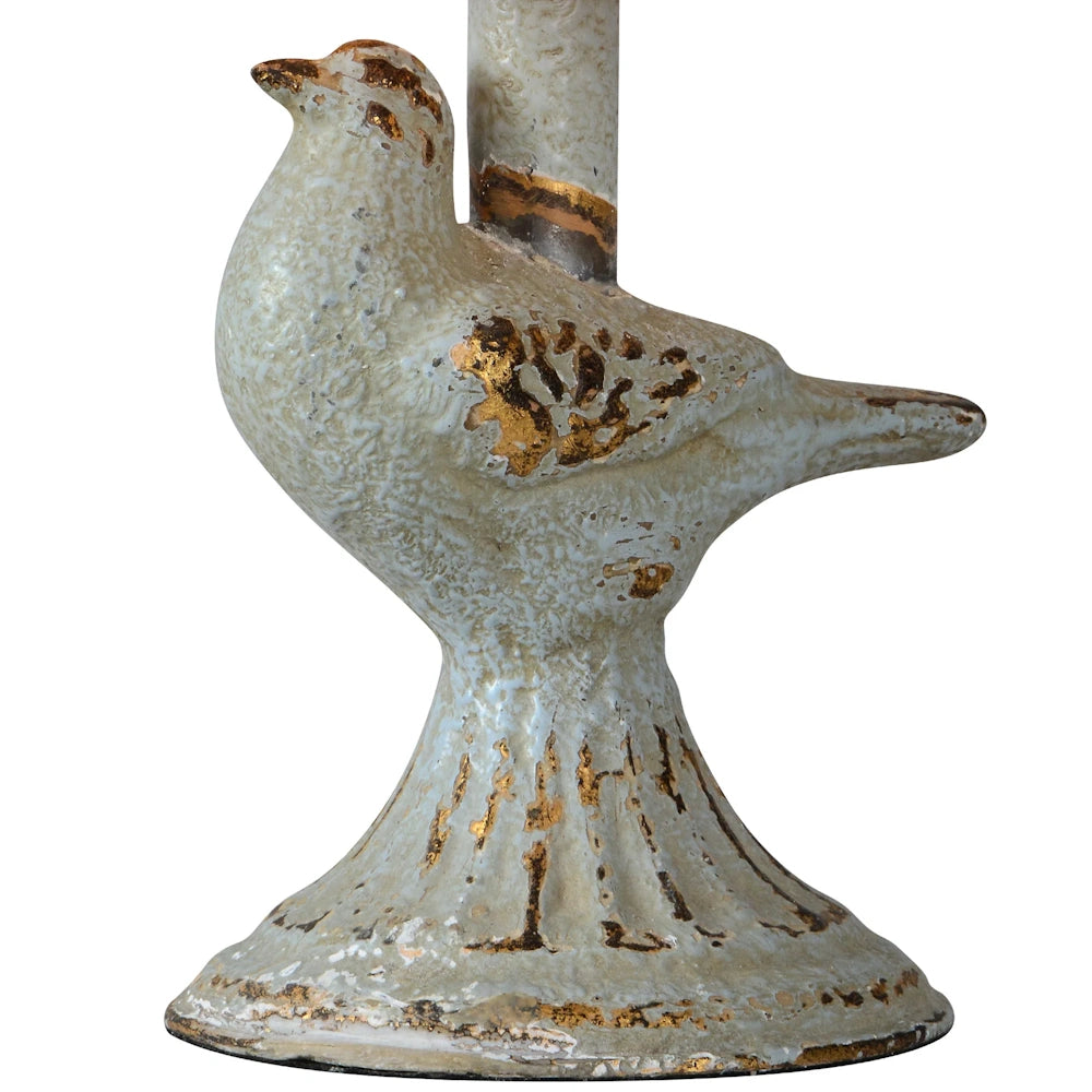 Rustic white ceramic bird figurine with distressed gold leaf accents on a pedestal base.