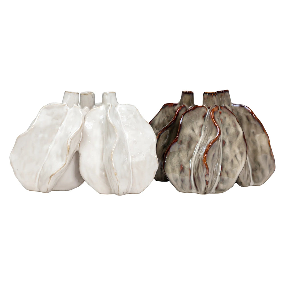 Two clusters of bumpy, organic-shaped ceramic bud vases, one set in glossy white and the other in metallic gray.