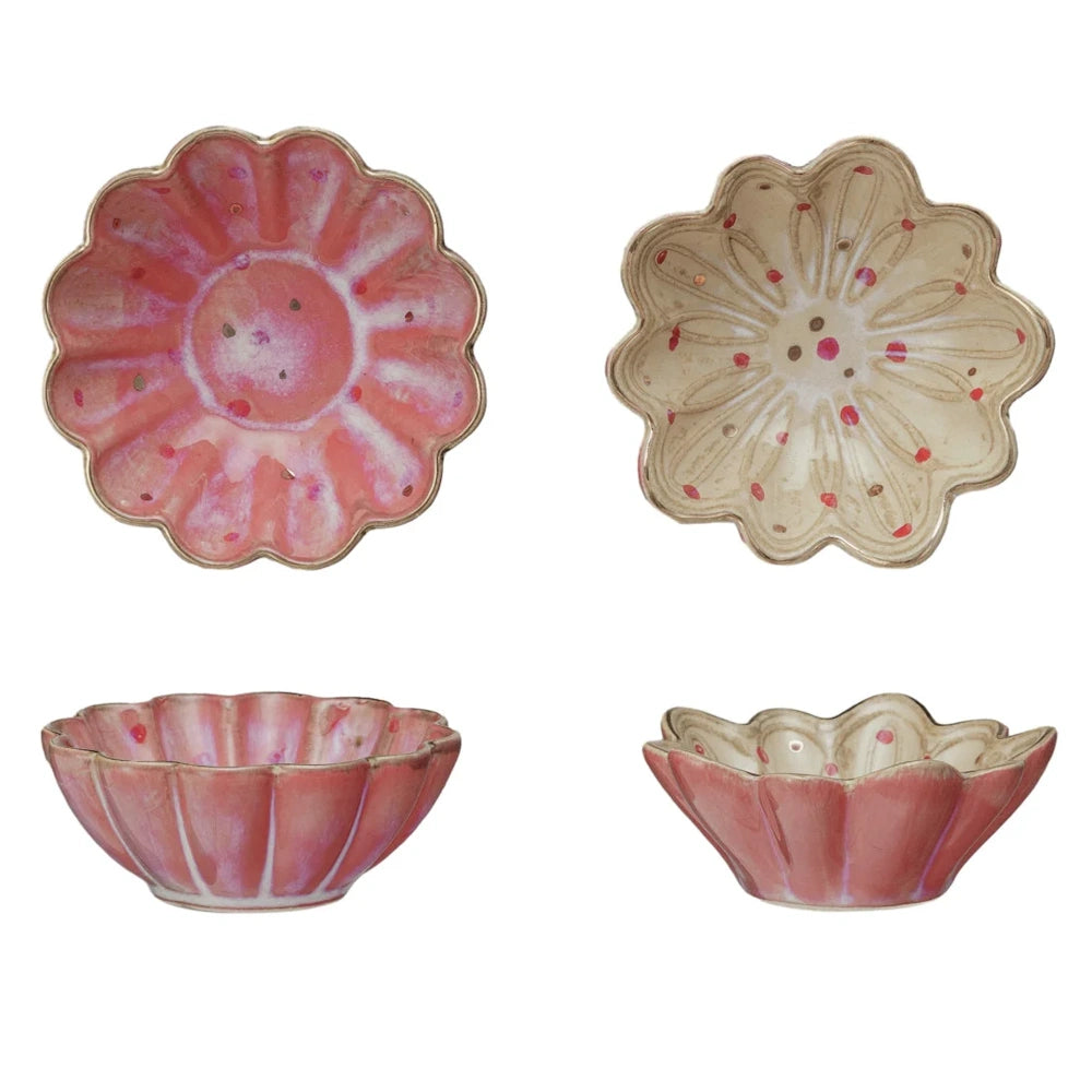 Round fluted stoneware dishes featuring speckled pink and cream floral designs from top and side views.