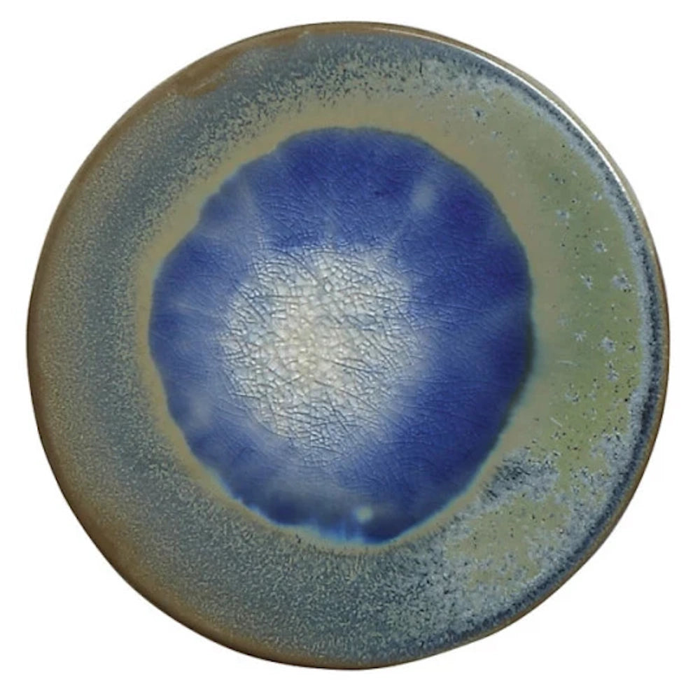 Round stoneware trivet with a blue crackle glaze center and a textured grey and green border for kitchen decor.