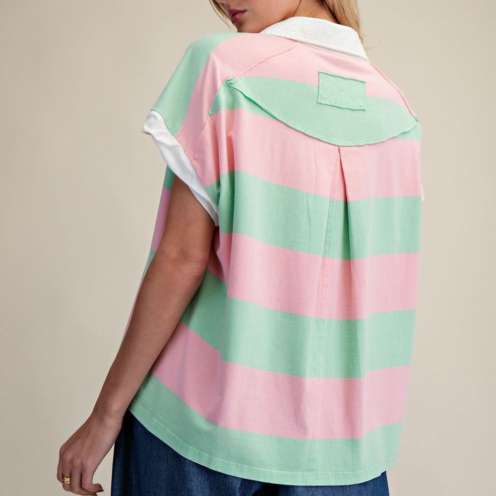 Back view of a pink and green rugby stripe washed henley top with a white collar and short sleeves.