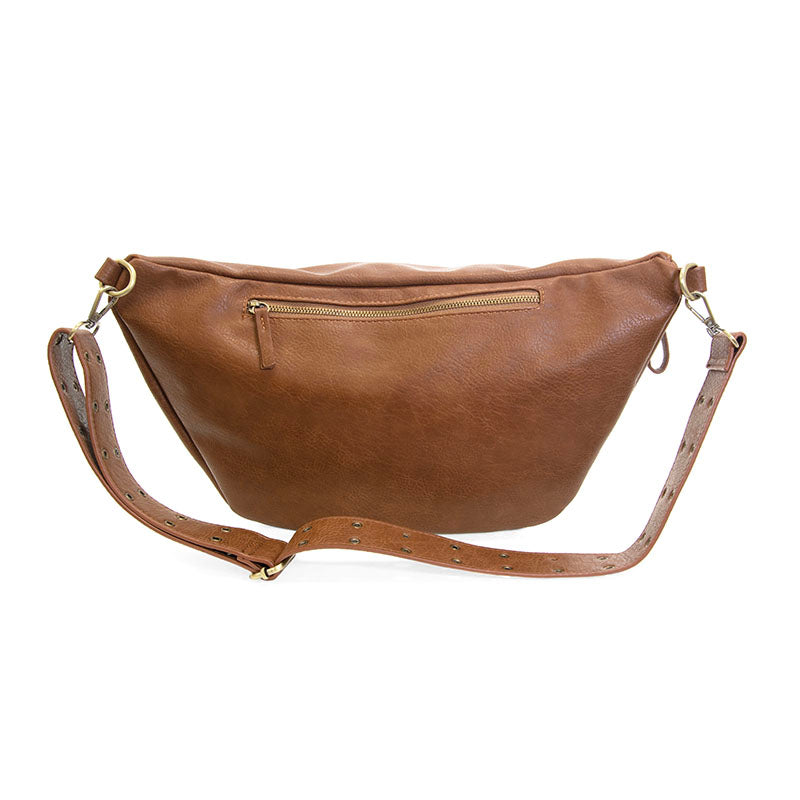 Large russet brown faux leather sling crossbody bag with a zippered pocket and adjustable grommet strap.