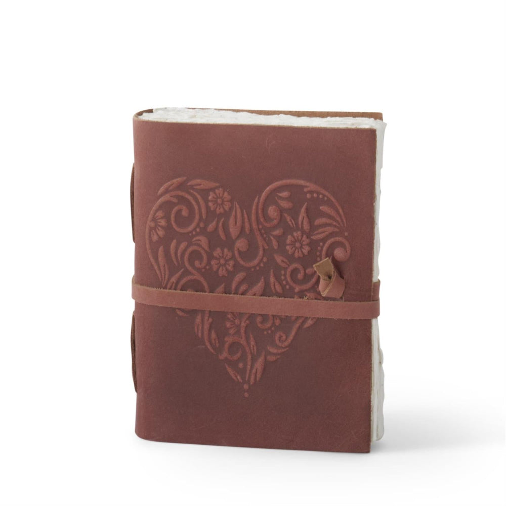 Rust leather handcrafted journal with embossed floral heart design, deckle edge paper, and wrap-around leather tie.