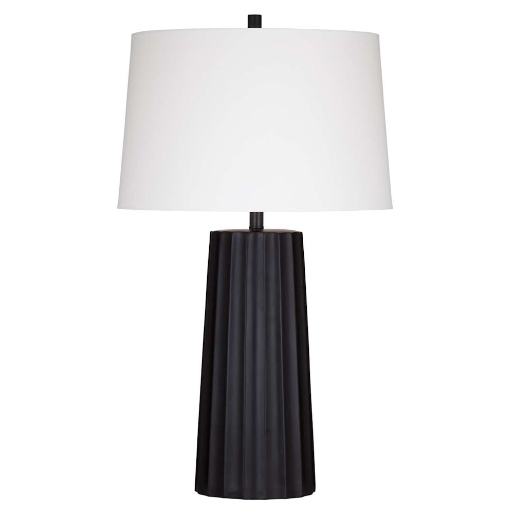 Modern black fluted ceramic table lamp with white drum shade for contemporary home decor.