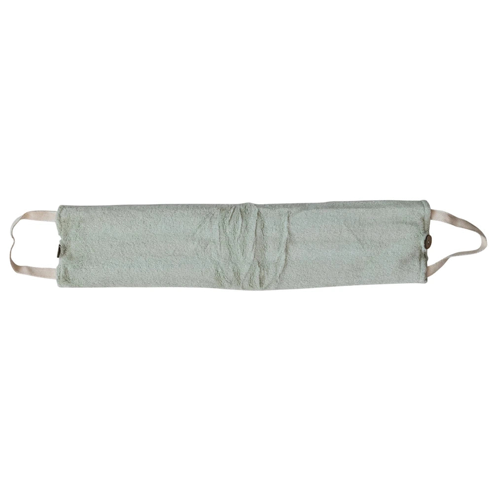 Soft sage green plush microwaveable neck wrap with handles for hot and cold therapy on a white background.