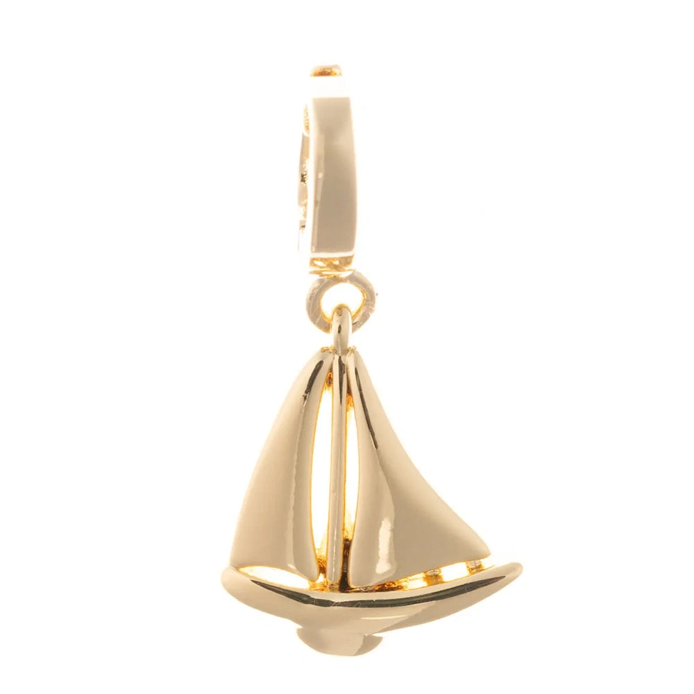 Polished gold sailboat pendant charm with detailed sails on a white background.