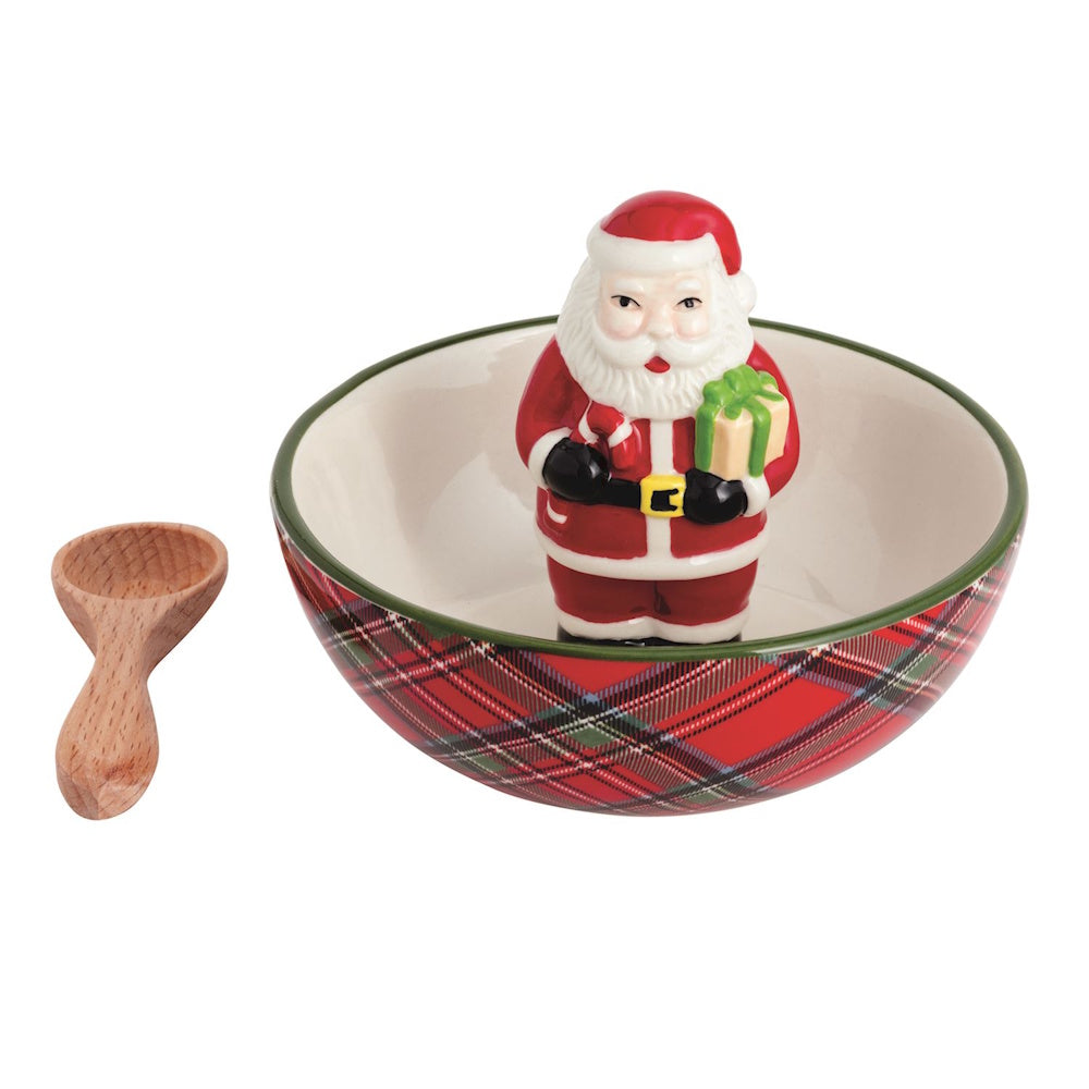 Red tartan plaid candy bowl with a center Santa Claus figurine and small wooden spoon.
