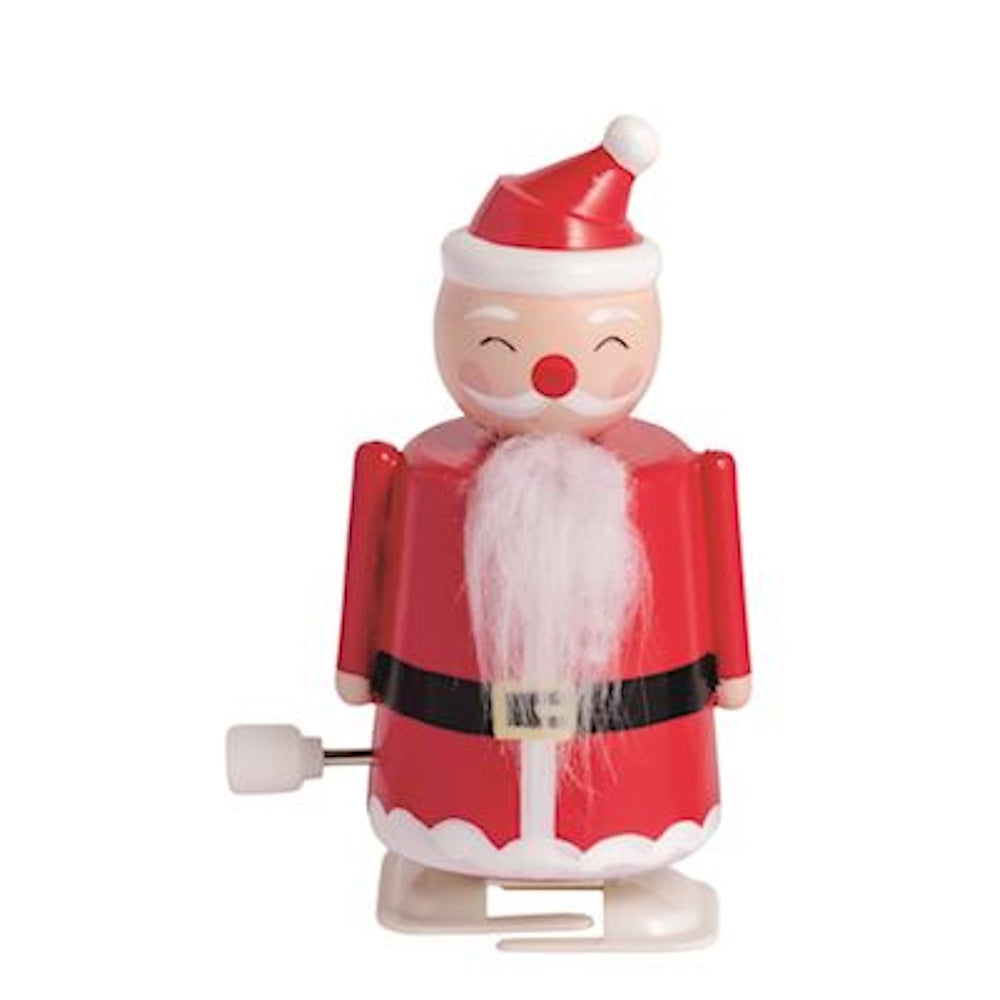 Small red and white wind-up Santa Claus toy with a fluffy white beard.