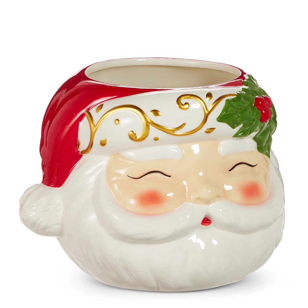 Ceramic Santa head container with a red hat, gold flourishes, and green holly leaves.