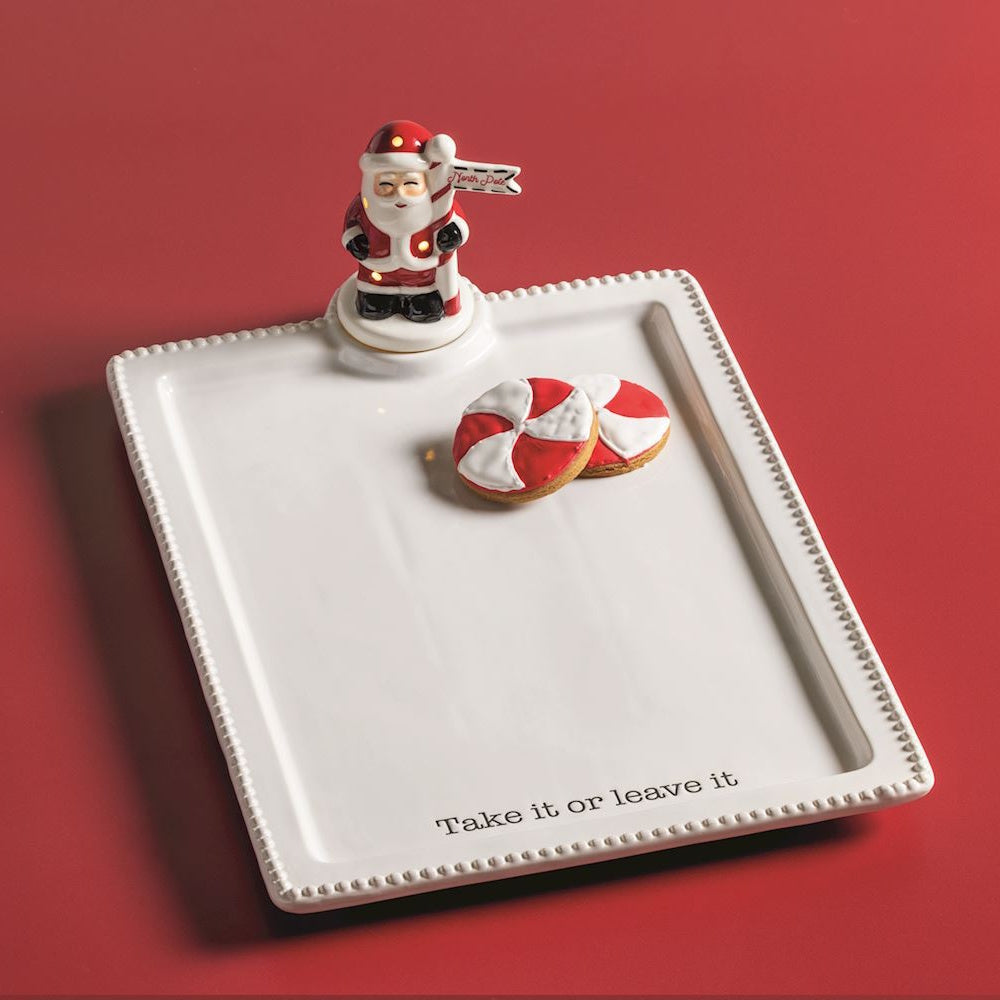 White ceramic tray with bead trim, Santa Claus topper, peppermint cookies, and "Take it or leave it".