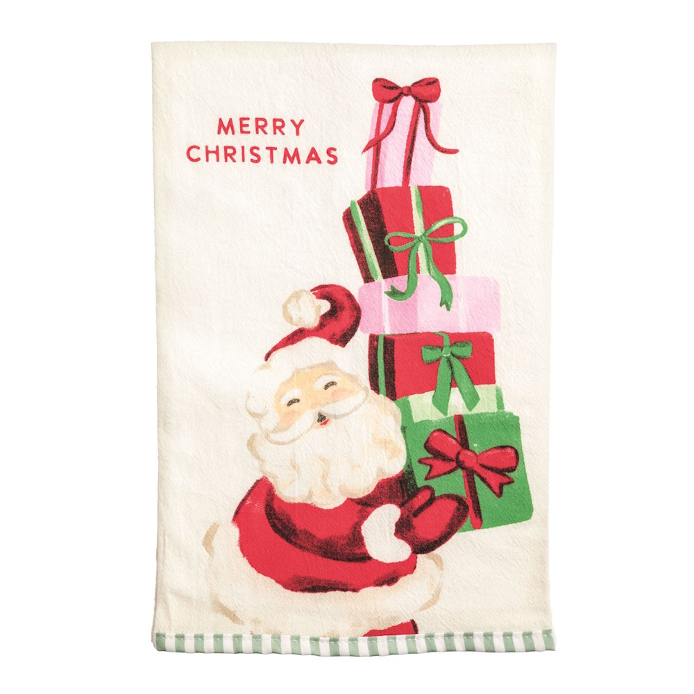 Santa Claus holding a tall stack of Christmas gifts on a towel with 'Merry Christmas' text.
