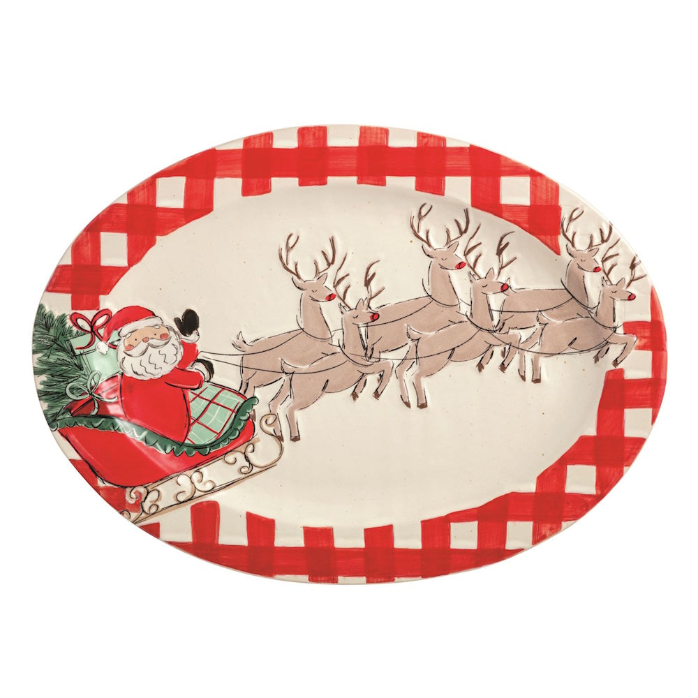 Oval serving platter with a red gingham border, featuring Santa in his sleigh pulled by reindeer.