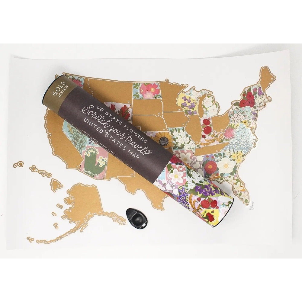 A gold scratch-off US map featuring floral illustrations under each state, shown with its matching storage tube.