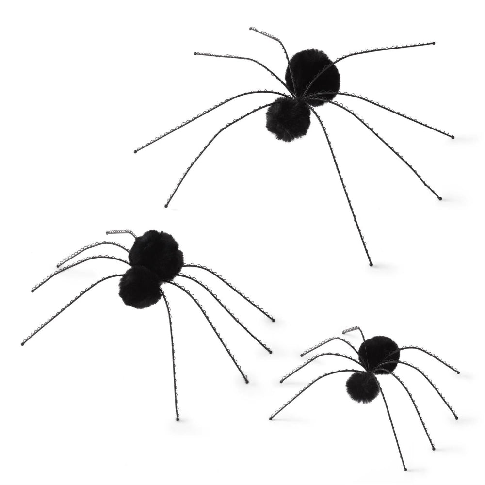 Set of three black wire Halloween spiders with fuzzy pom-pom bodies on a white background.