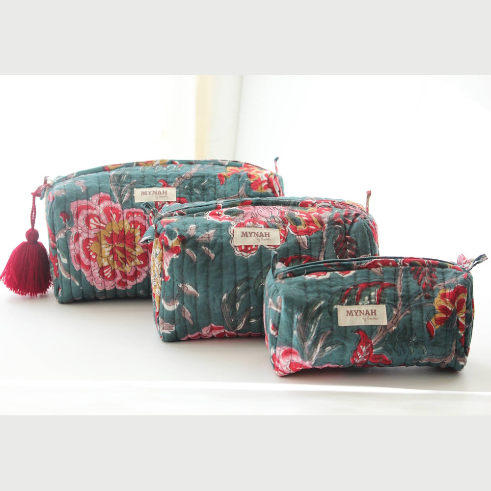 Set of three Mynah by Smitha emerald garden floral print quilted cotton zipper pouches with red tassel detail.