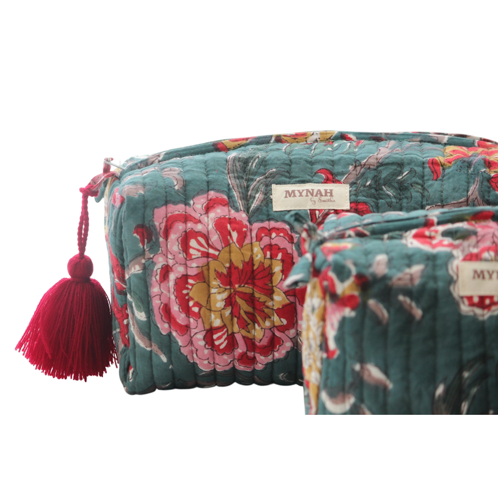 Quilted emerald green block print zipper pouches with red floral patterns and a red tassel by MYNAH.