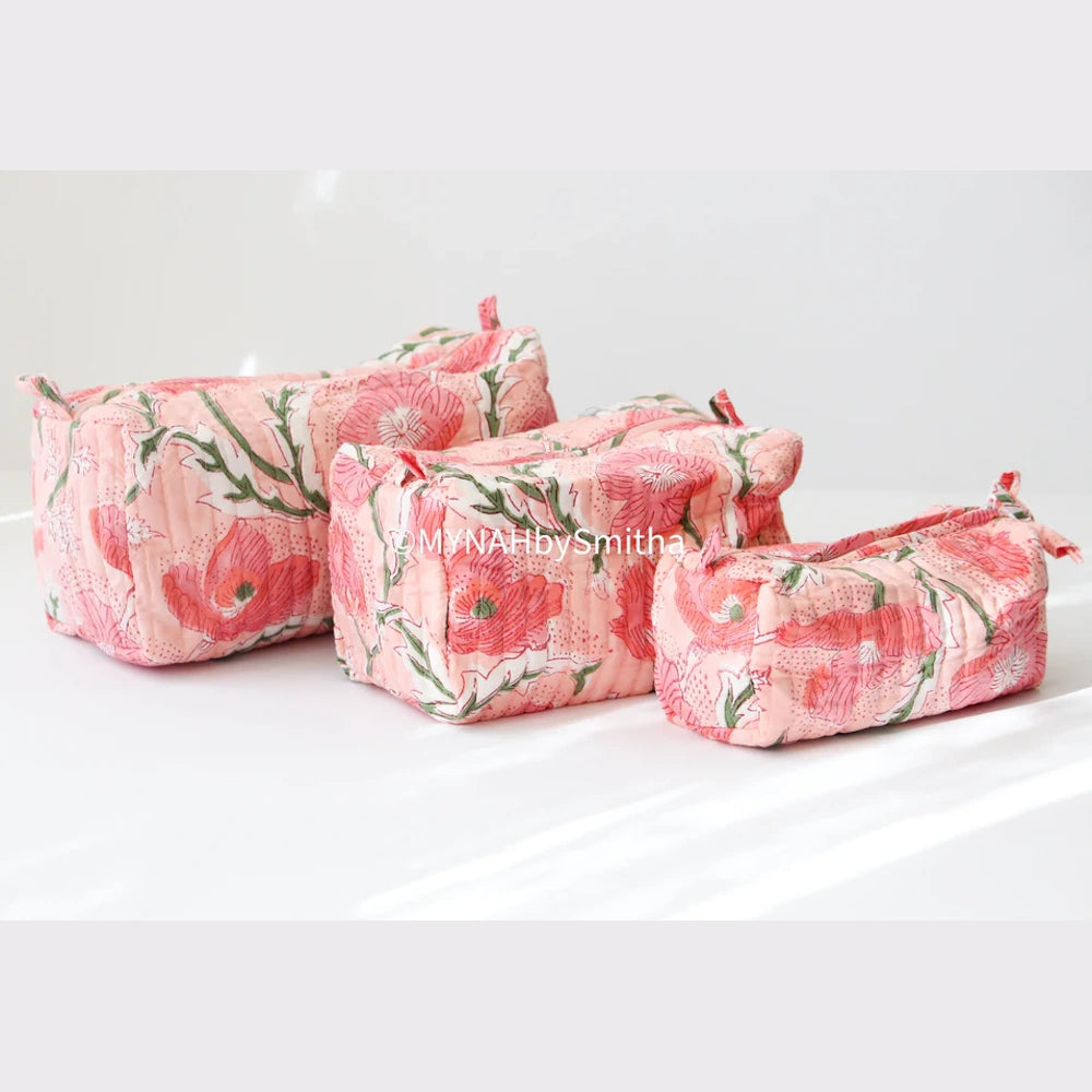 Set of 3 peach poppy print quilted zipper pouches in varying sizes, handcrafted with floral block print fabric.
