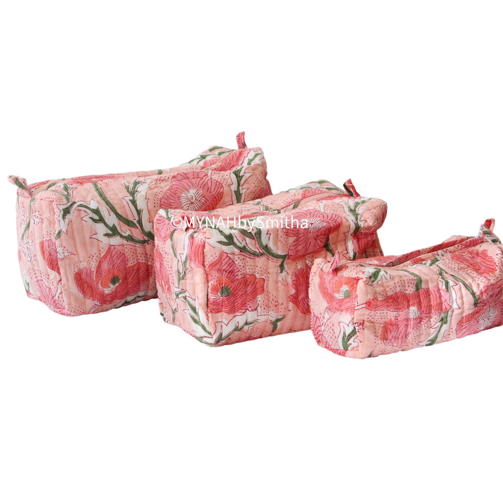 Set of 3 peach block print quilted zipper pouches featuring pink poppy floral patterns.