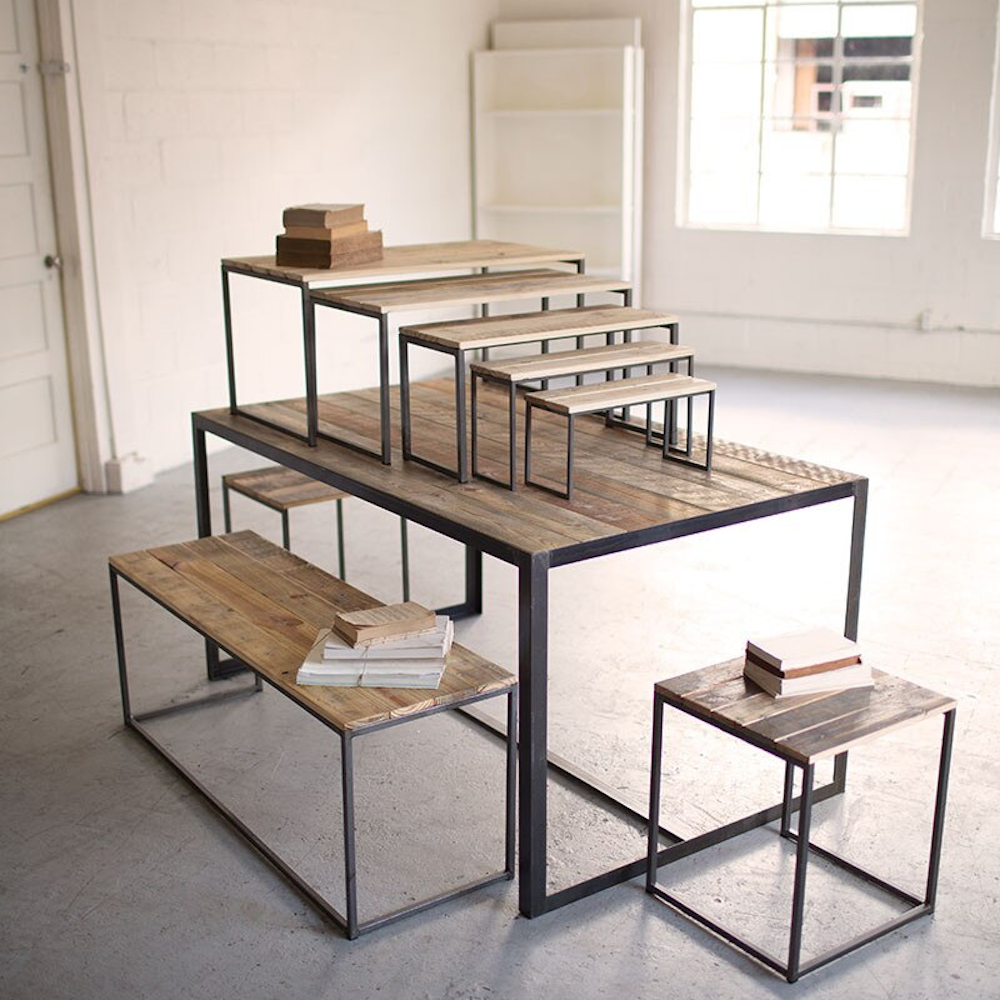 Set of 9 industrial display nesting tables made from recycled wood and iron, perfect for retail or home decor.