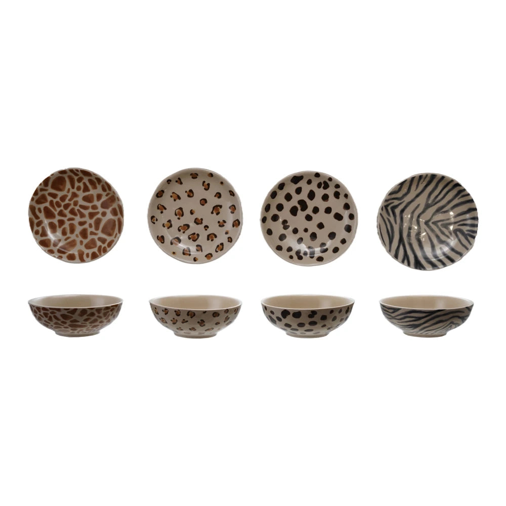 Set of 4 animal print ceramic bowls featuring giraffe, leopard, cheetah, and zebra patterns on a white background.