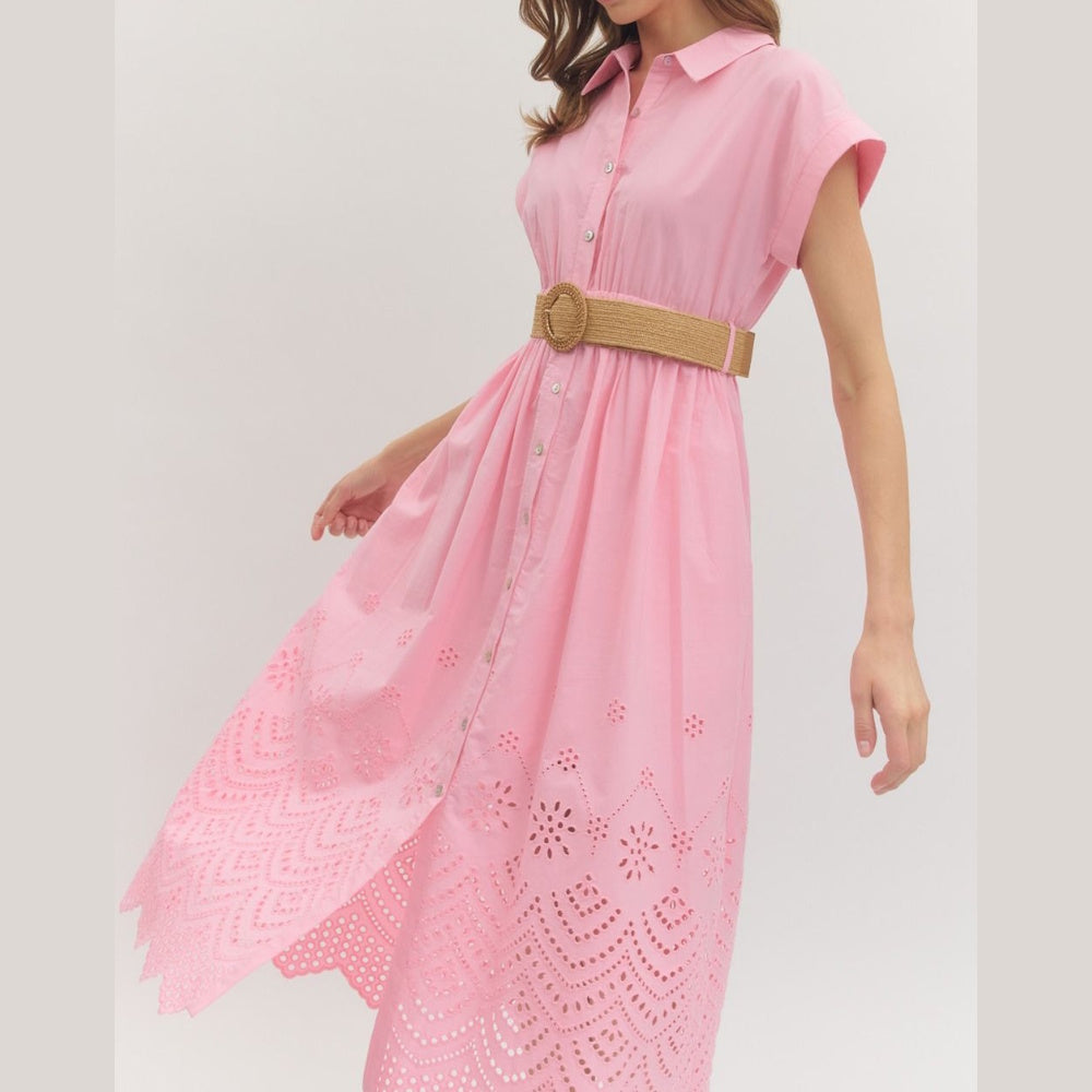 Pink midi shirt dress with cuffed sleeves, eyelet embroidery hem, and a straw belt with a round buckle.