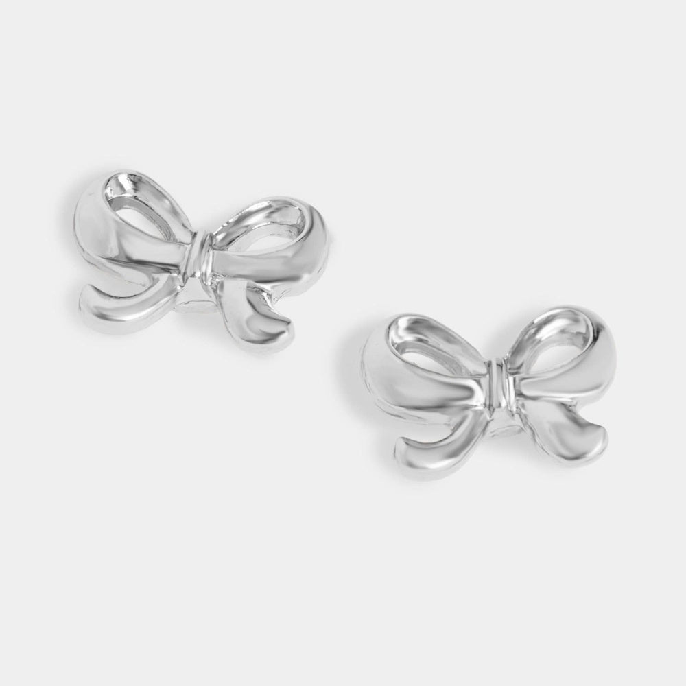 Pair of high-shine silver bow stud earrings with a smooth metallic finish on a plain white background.