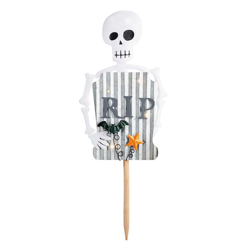 Skeleton Halloween yard stake decoration holding a striped RIP tombstone sign.