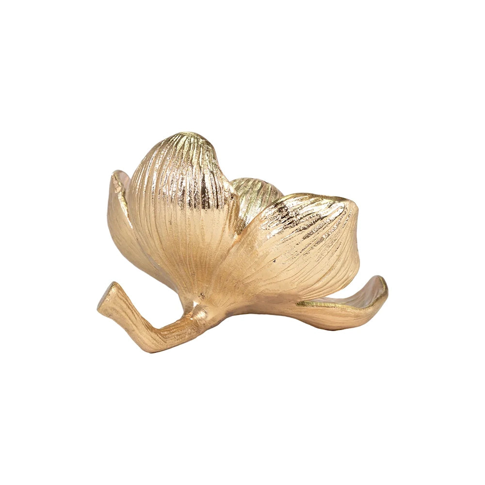 Gold flower sculpture with a curved stem and textured petals.