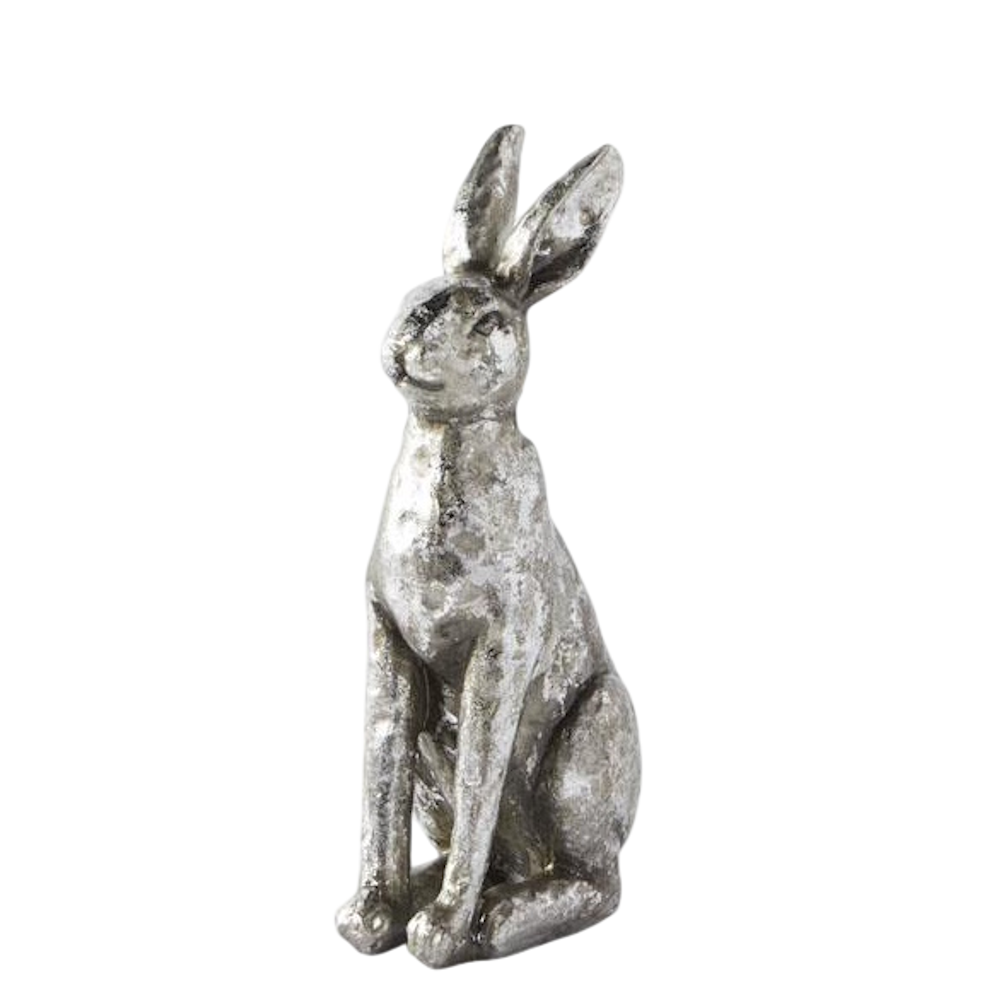 Silver-colored textured rabbit figurine sitting upright against a white background.