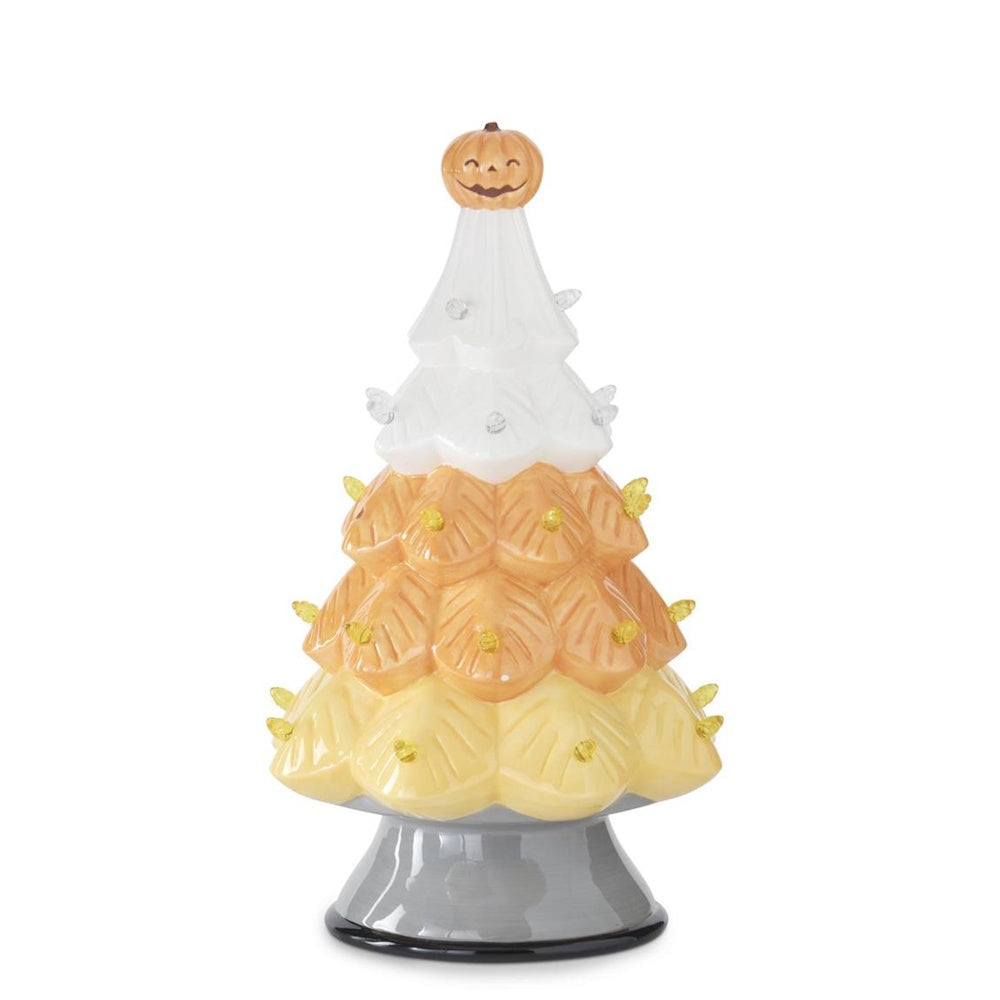 Ceramic Halloween tree painted like candy corn with a jack-o'-lantern topper and small lights.