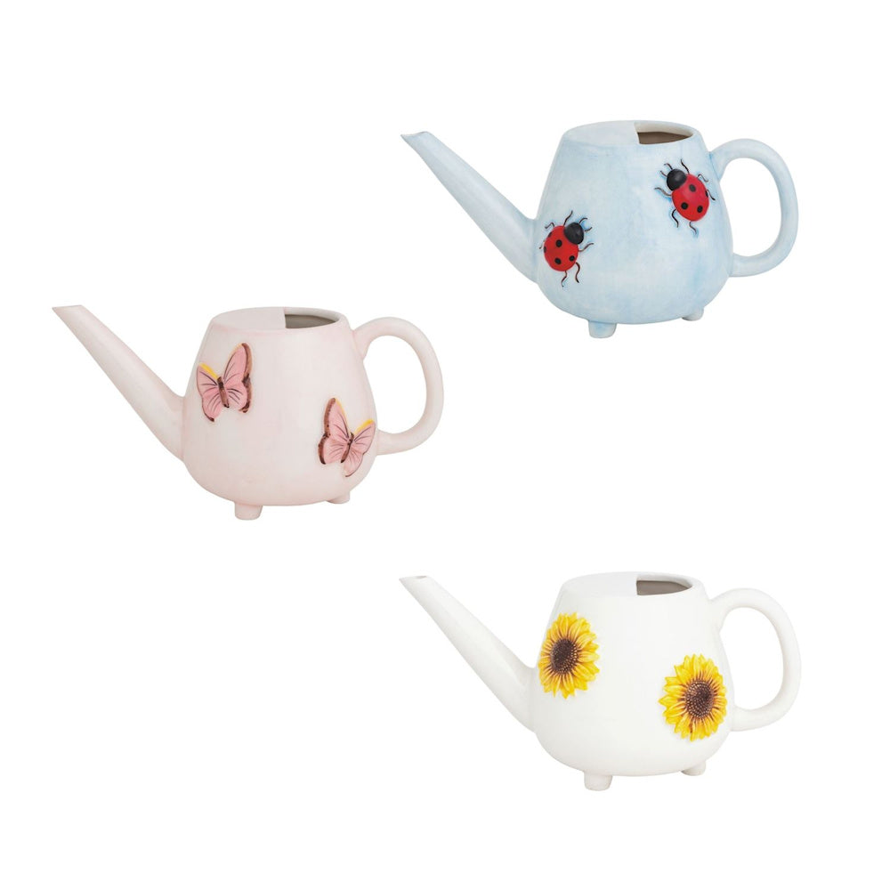 Set of 3 small ceramic watering cans with ladybug, butterfly, and sunflower designs for indoor plants and home decor.