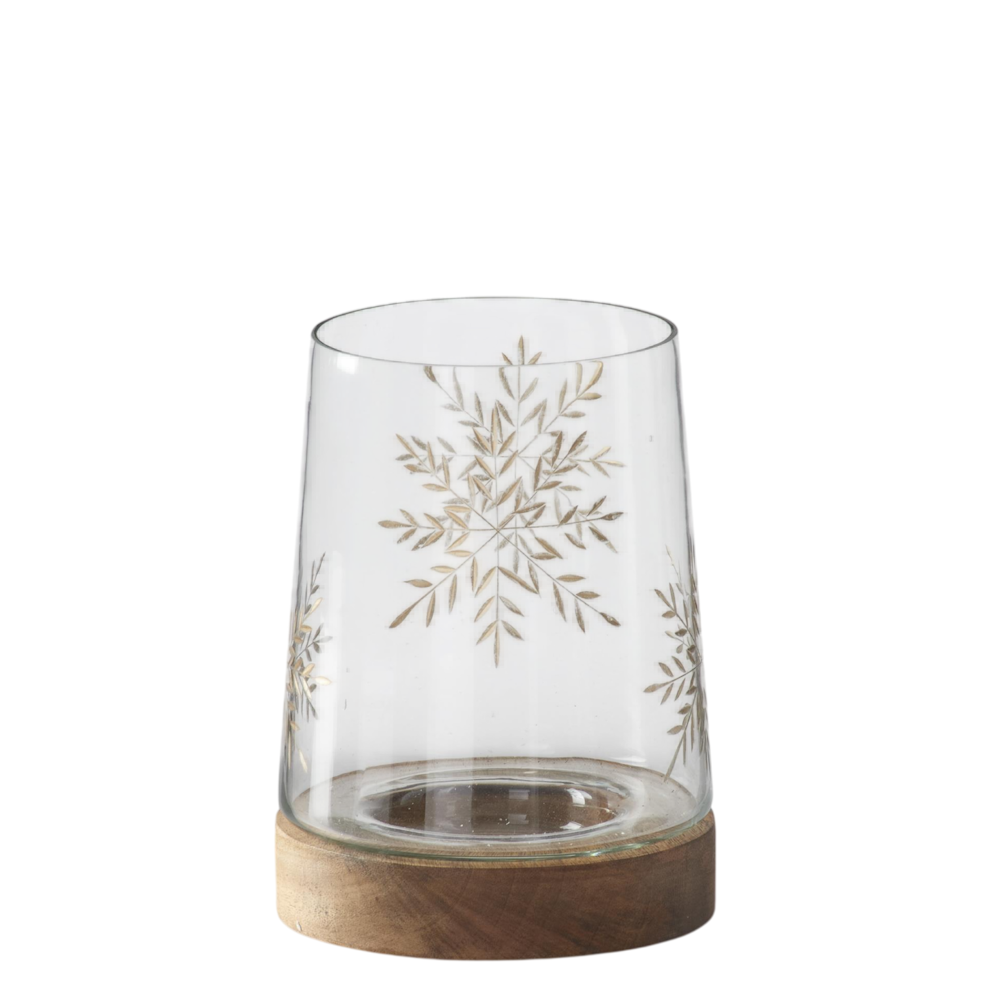 Small clear glass container with a gold-etched snowflake design and a wooden base.
